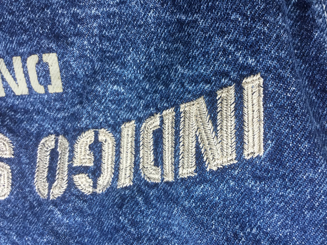 Back of denim jacket spell out indigo system dnm