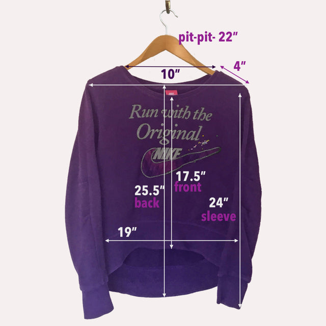 Showing measurements of purple Nike sweatshirt