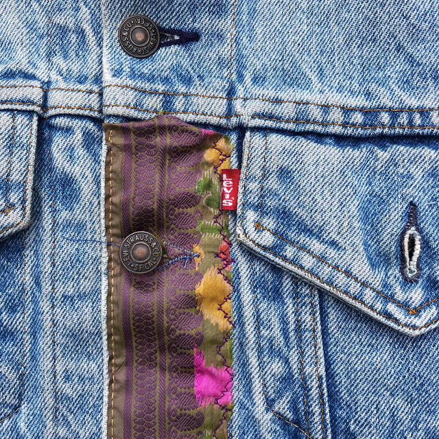 Close up of Levis denim jacket with strip of patchwork