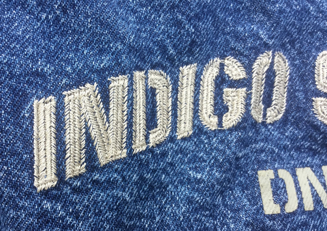 embroidered indigo system on denim