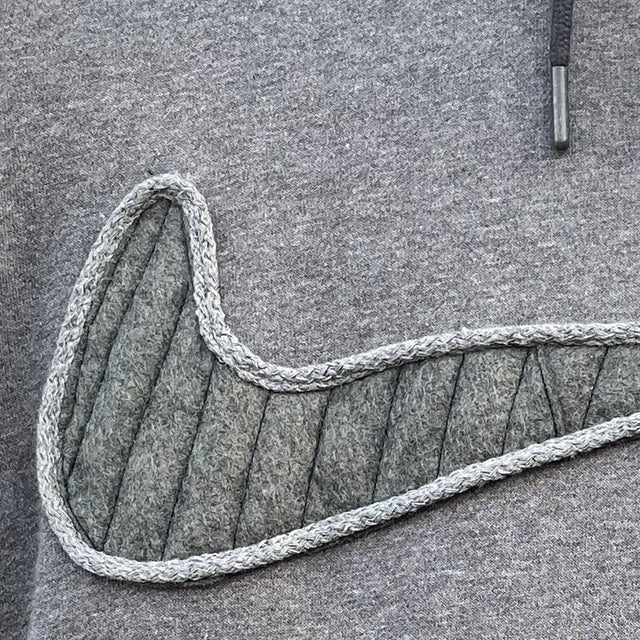 Close up of grey quilted nike swoosh