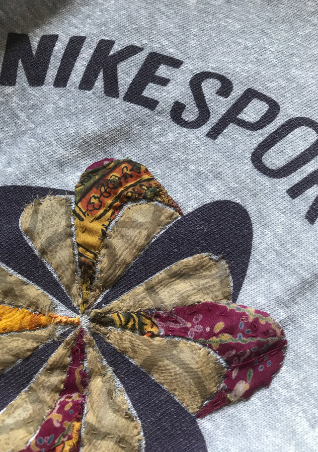 patterned fabric sewn on Nike pinwheel logo